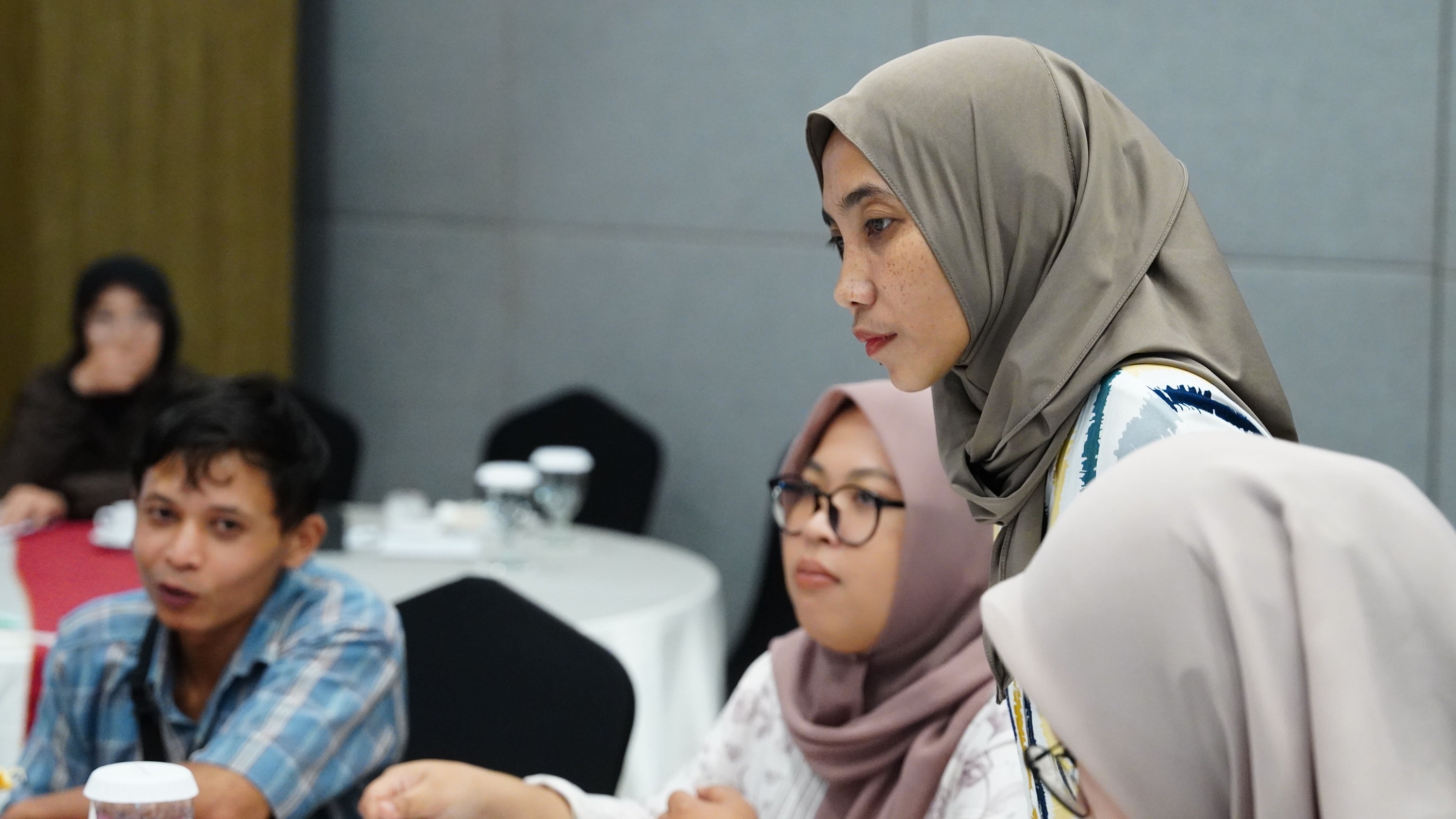 Group analysing completed canvases