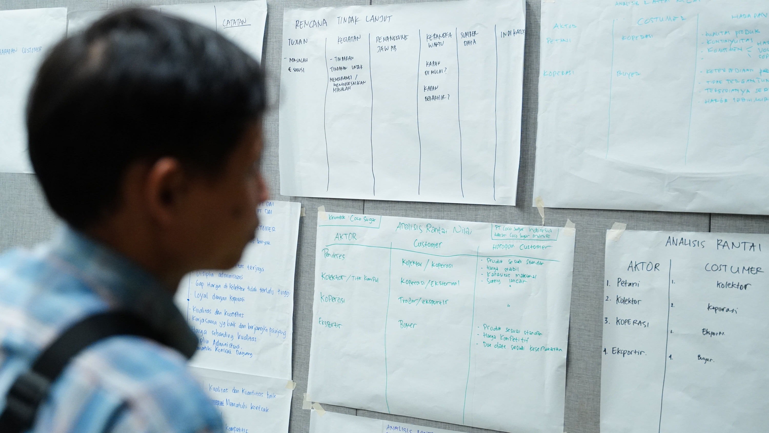 Smiling participant responding during plenary
