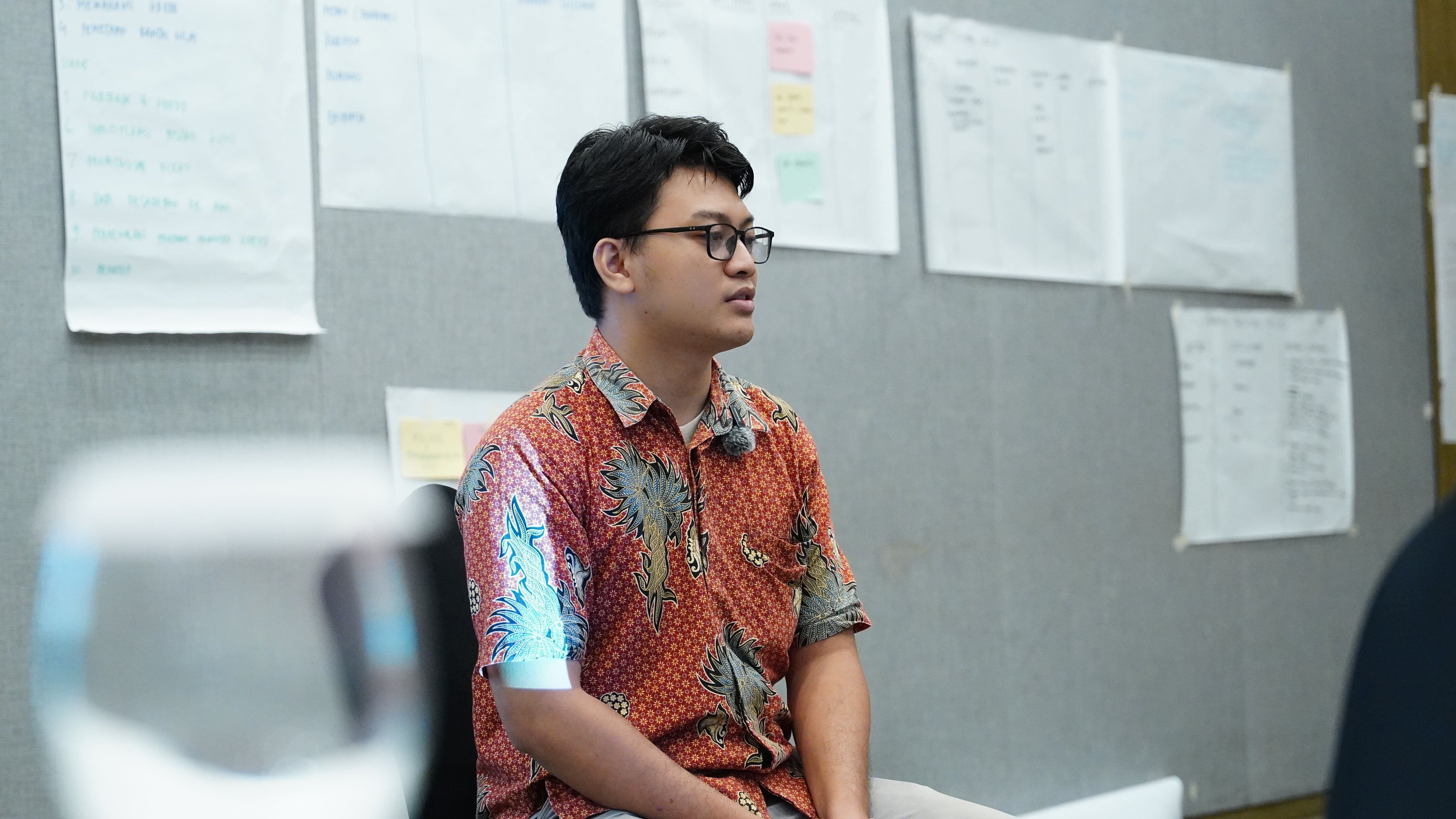 Participant capturing strategy notes on canvas