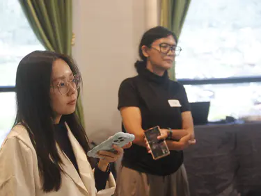 Participants writing on sheets